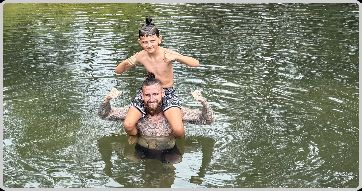 Brodie Salnitro swimming with his son